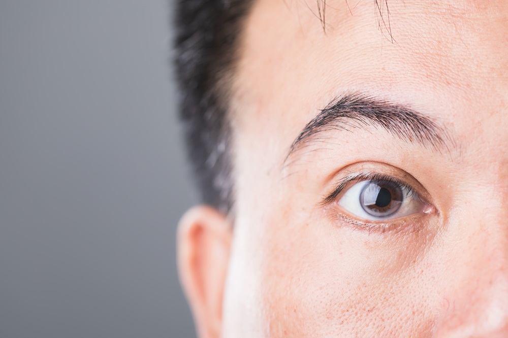 Close-up of patient eye for retina examination - IC Retina Detailed view of human eye showing cornea and pupil for retinal health evaluation at IC Retina clinic - IC Retina